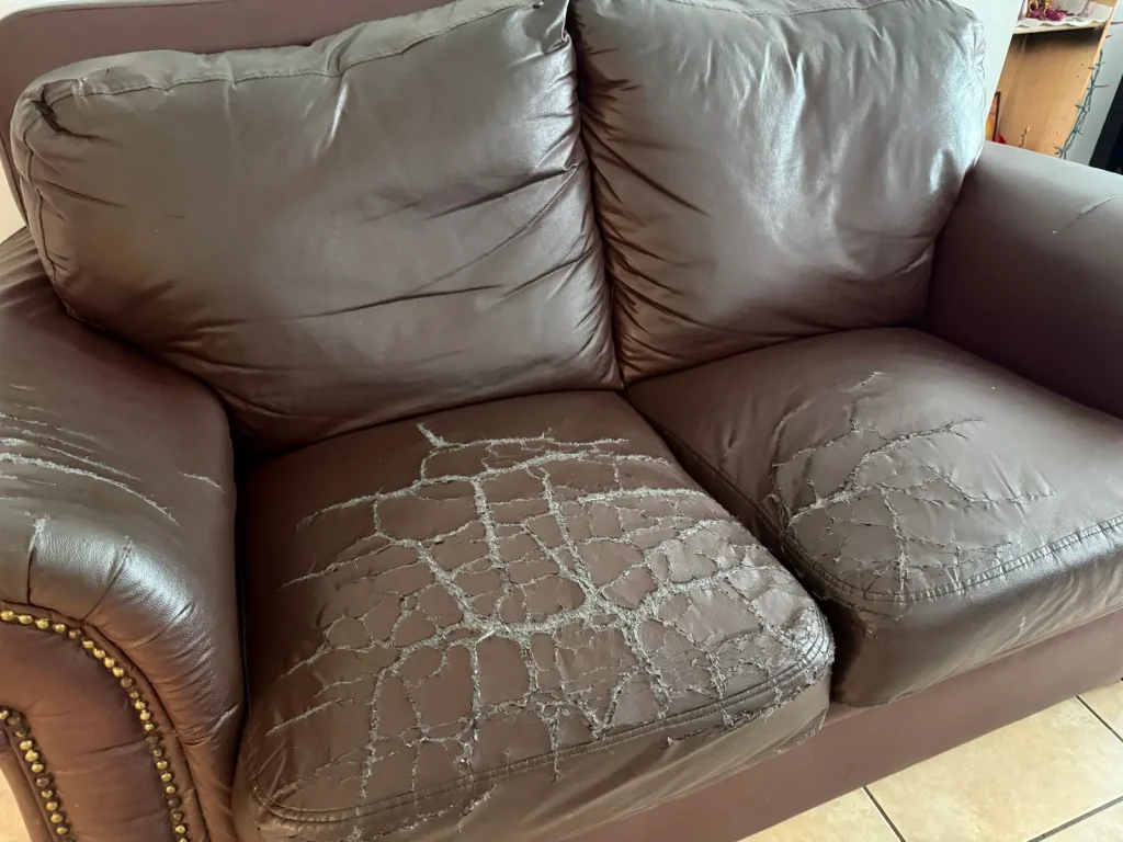 Flaking, cracking leather sofa before replacements